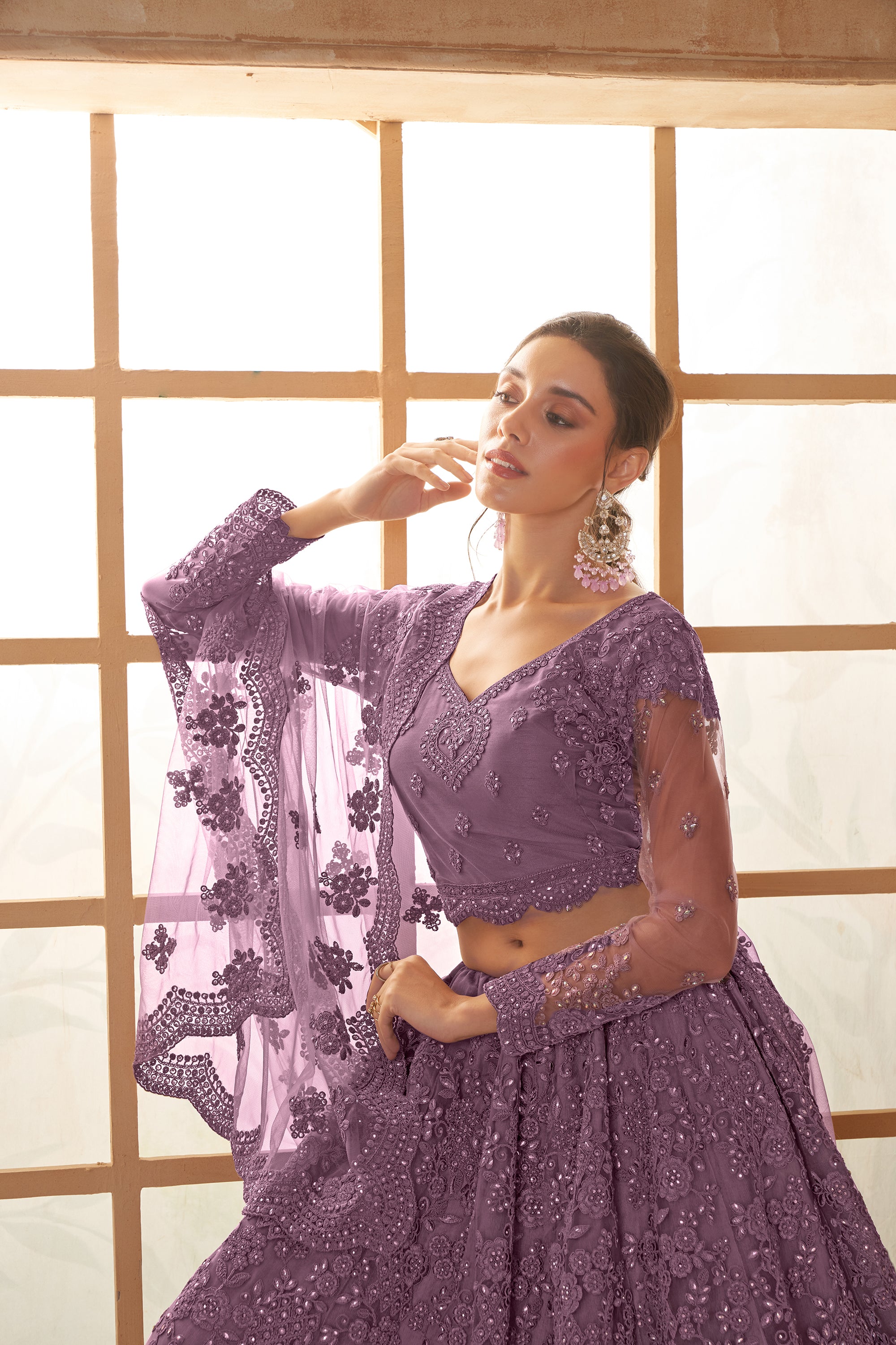 Purple Color Heavy Embroidered Net Lehenga Choli With Dupatta