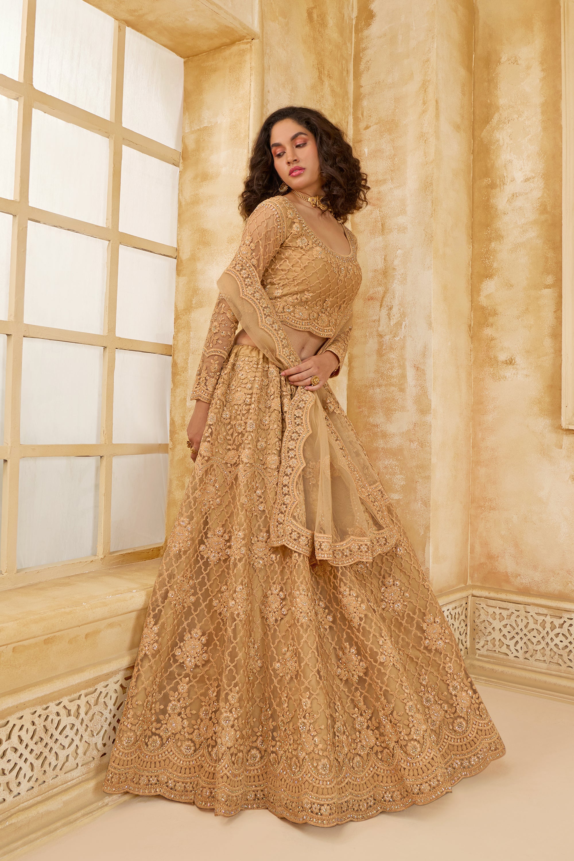 Golden Color Heavy Embroidered Net Lehenga Choli With Dupatta