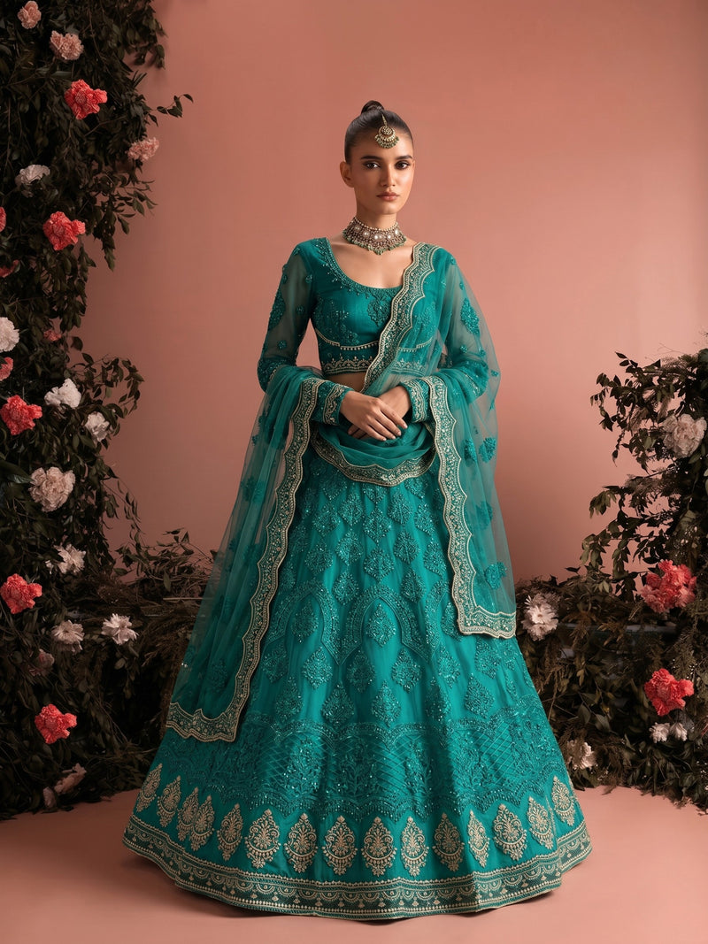 Luxury teal bridal lehenga with embroidered butterfly net and ornate borders