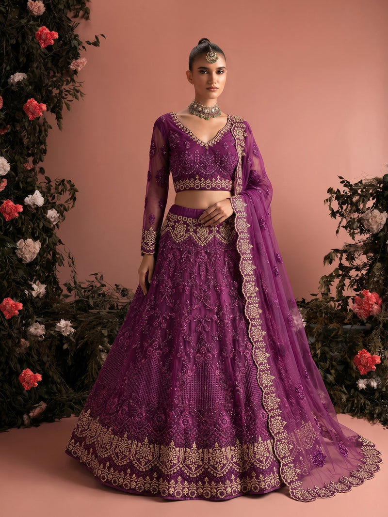 Woman wearing luxury amethyst embroidered lehenga set with sheer dupatta and intricate bridal embroidery