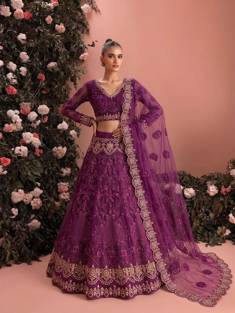Designer purple bridal lehenga with embroidered net dupatta and ornate festive detailing