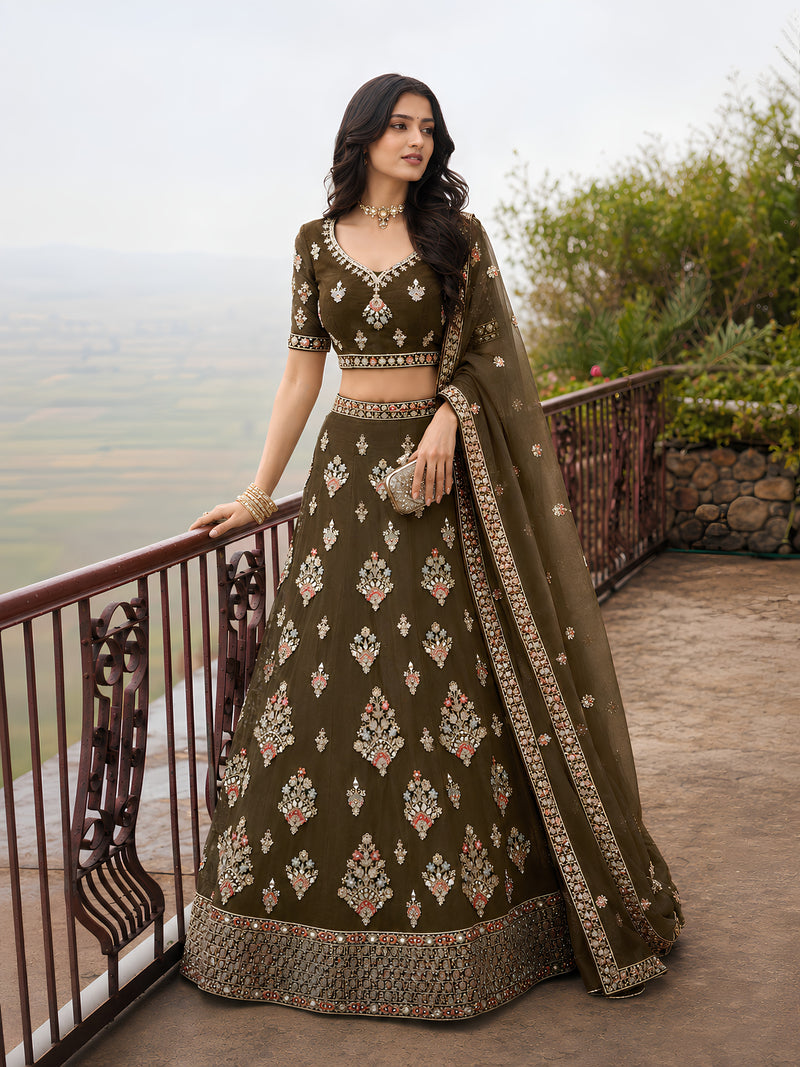 Olive green embroidered bridal lehenga set with detailed blouse, full flared skirt and ornate dupatta