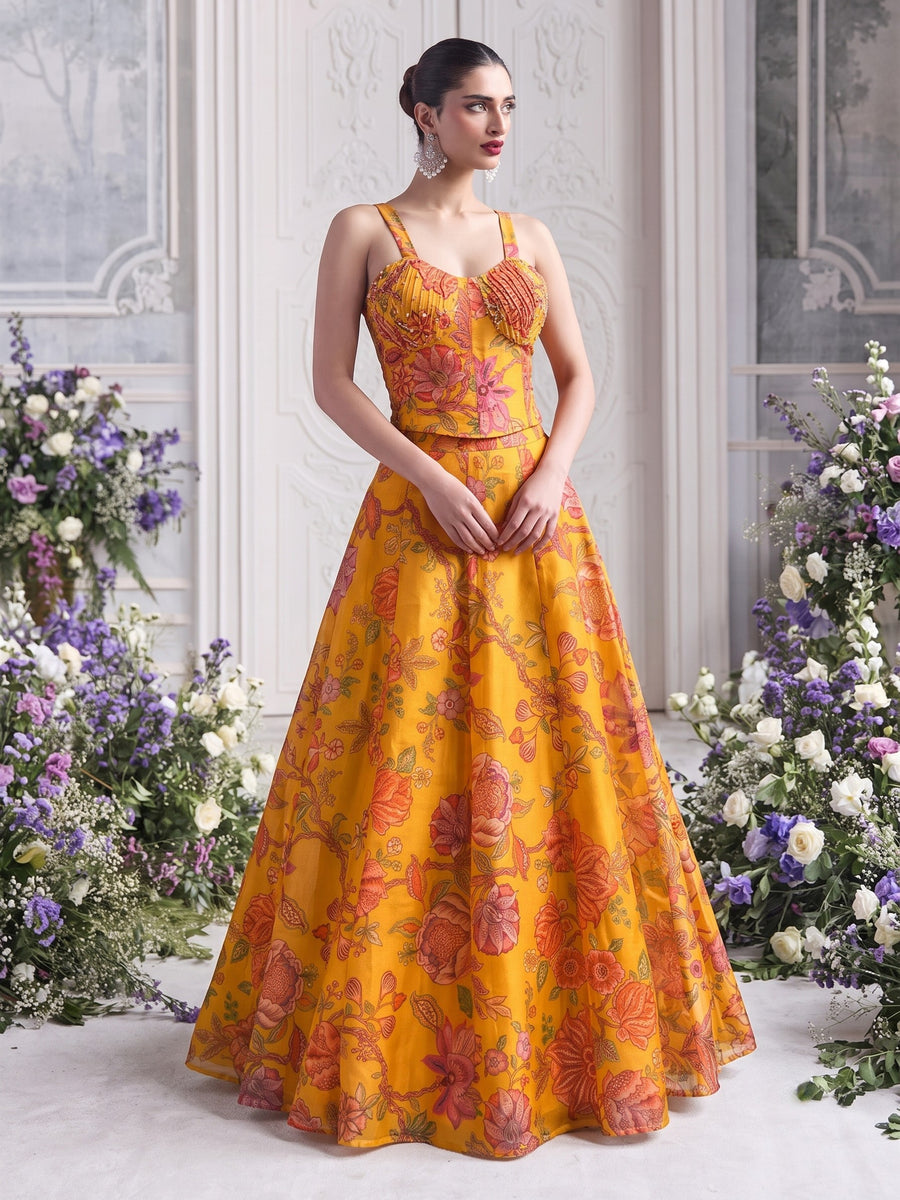 Front view of Floréa Golden Marigold luxury floral printed lehenga with modern corset blouse and flowing designer silhouette.