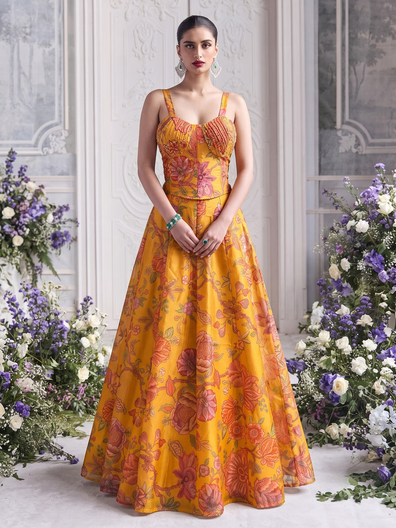 Floréa Golden Marigold printed Tabby Organza lehenga set featuring a structured corset blouse and floral designer lehenga for haldi and destination weddings.