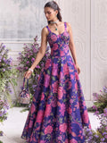 Floréa Royal Purple printed Tabby Organza lehenga set with a contemporary corset blouse and flowing floral designer lehenga for weddings and festive occasions.