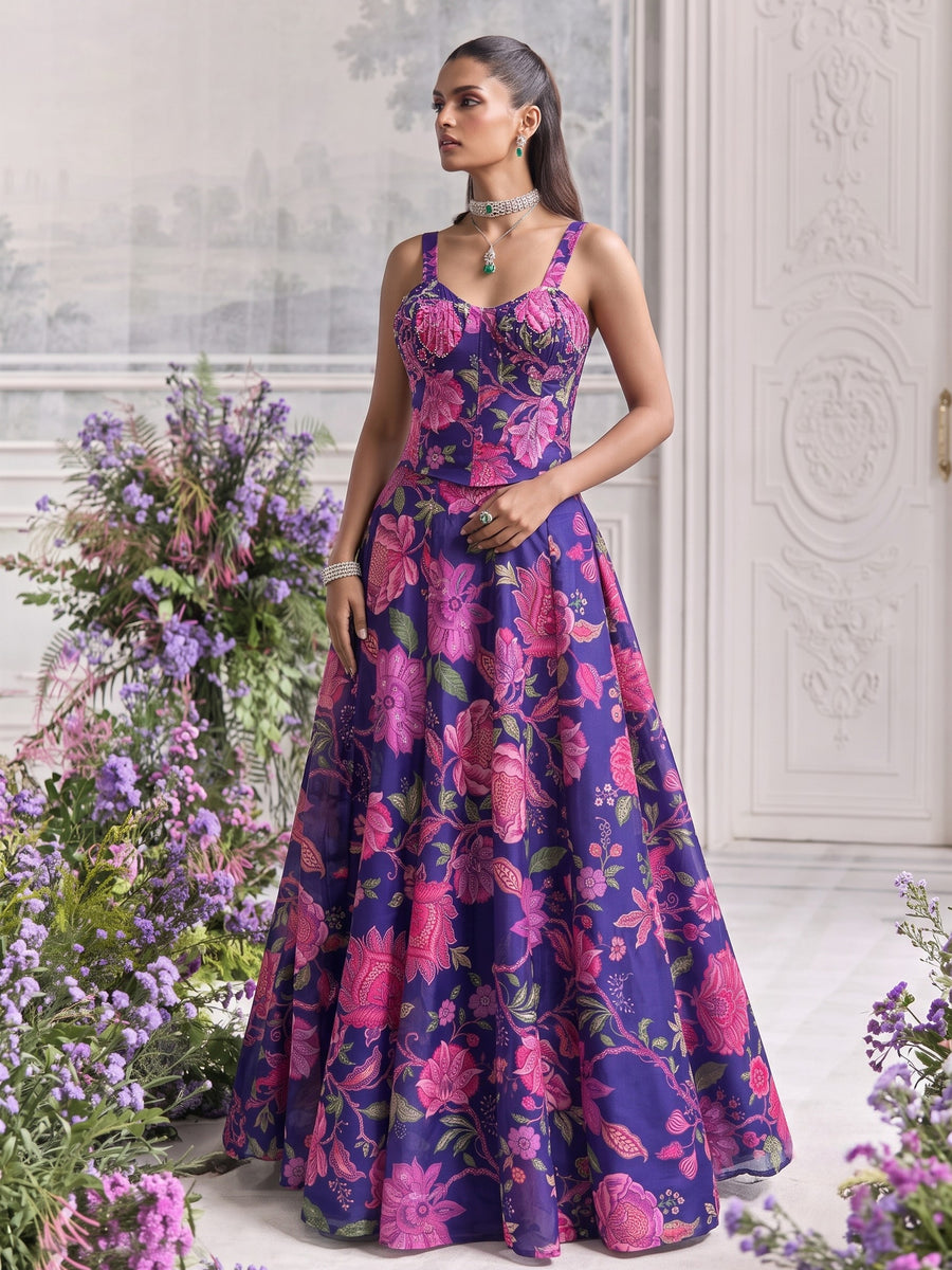 Angled front view of Floréa Royal Purple floral printed designer lehenga featuring a structured corset blouse and elegant full-flare silhouette