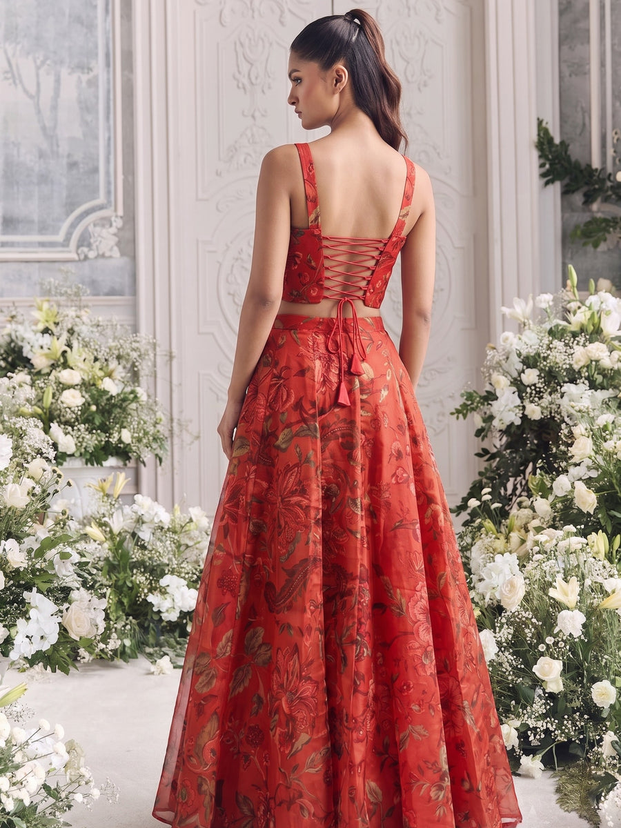 Back view of the Floréa Scarlet Red lehenga showcasing the adjustable lace-up corset back and elegant full-flare silhouette.
