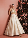 Ivory embroidered lehenga set for women shown with full flared skirt and sheer net dupatta