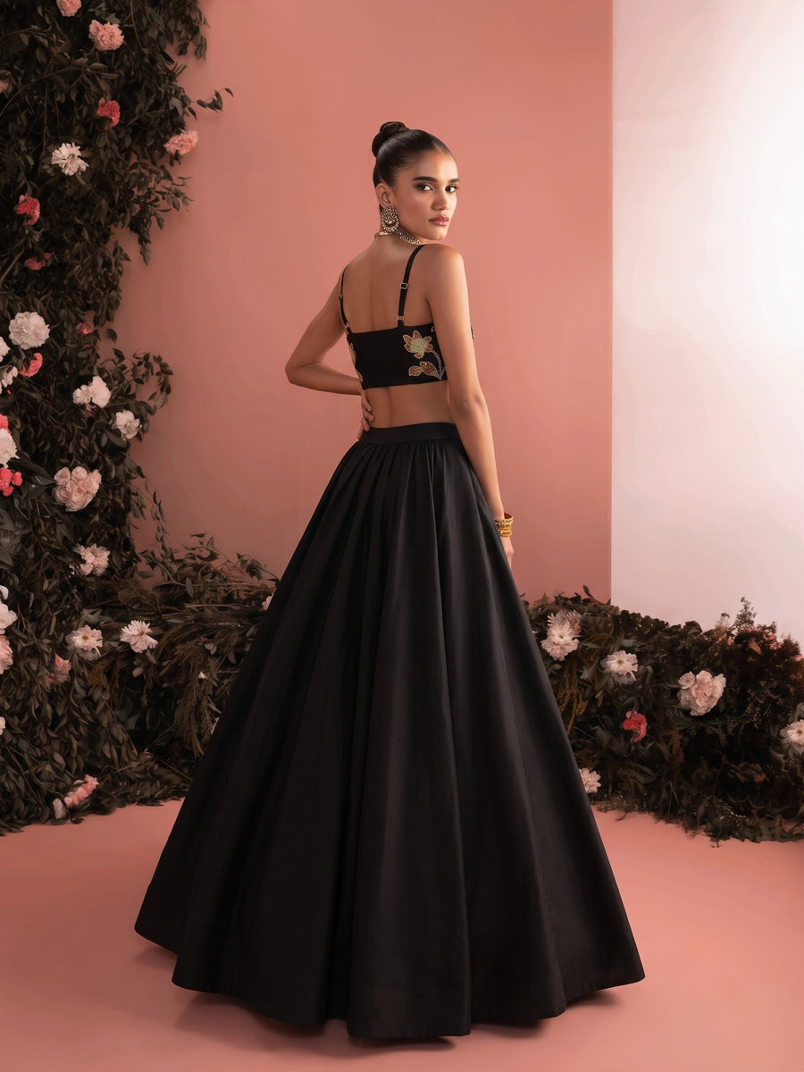 Back view of Liora black embroidered lehenga set with strappy blouse and full flared skirt