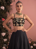 Close-up of black lehenga blouse with intricate floral bead embroidery and adjustable straps