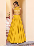 Yellow embellished lehenga set styled with a sheer net dupatta and full flowing Roman silk skirt