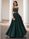 Deep emerald green lehenga with gold-detailed choli and flowing full-length skirt