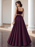 Back view of the deep plum lehenga set showing the smocked choli panel and full-length skirt