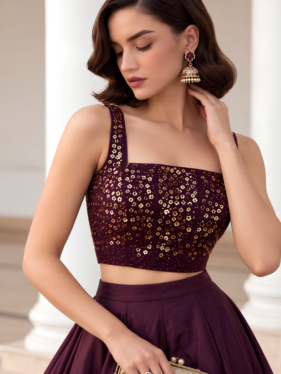 Close-up of the Midnight Noir plum choli showing intricate gold embellishment, square neckline and slim straps