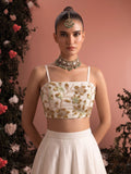 Close-up of ivory lehenga blouse showing intricate floral bead embroidery